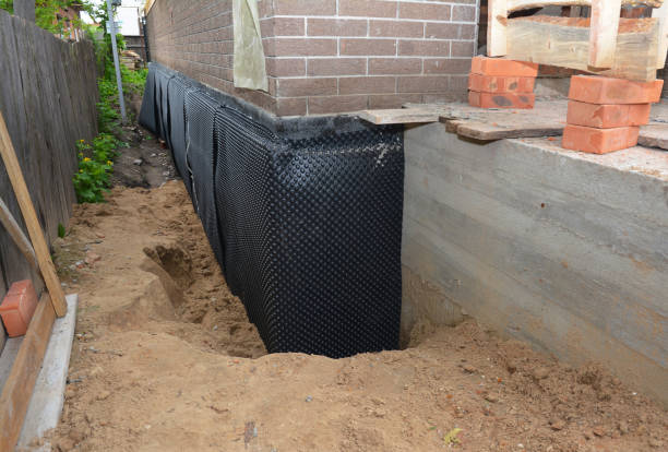 Happy homeowners after waterproofing job in Clifford